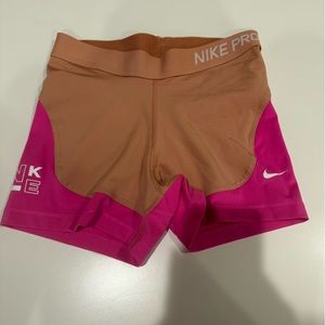 Pink and tan Nike pros
